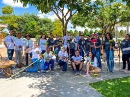 Voluntários da Sicoob Credisul e Favoo pintam muro da Ong em Vilhena