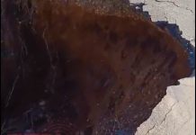 Em vídeo, bombeiro alerta motoristas sobre cratera na rodovia entre Vilhena e Colorado