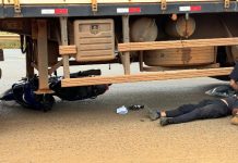 Motociclista é socorrido e encaminhado ao hospital após colisão com carreta em Vilhena